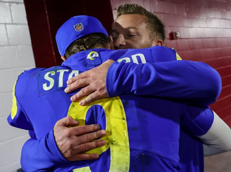 Tampa, Florida, Sunday, January 23, 2022 - Los Angeles Rams head coach Sean McVay rushes to hug quarterback Matthew Stafford.