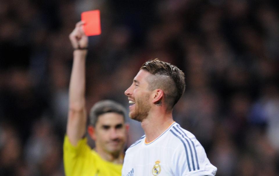 Sergio Ramos of Real Madrid is shown the red card by referee Alberto Undiano Mallenco during the La Liga match between Real Madrid CF and FC Barcelona at the Bernabeu on March 23, 2014 in Madrid, Spain - Denis Doyle/Getty Images