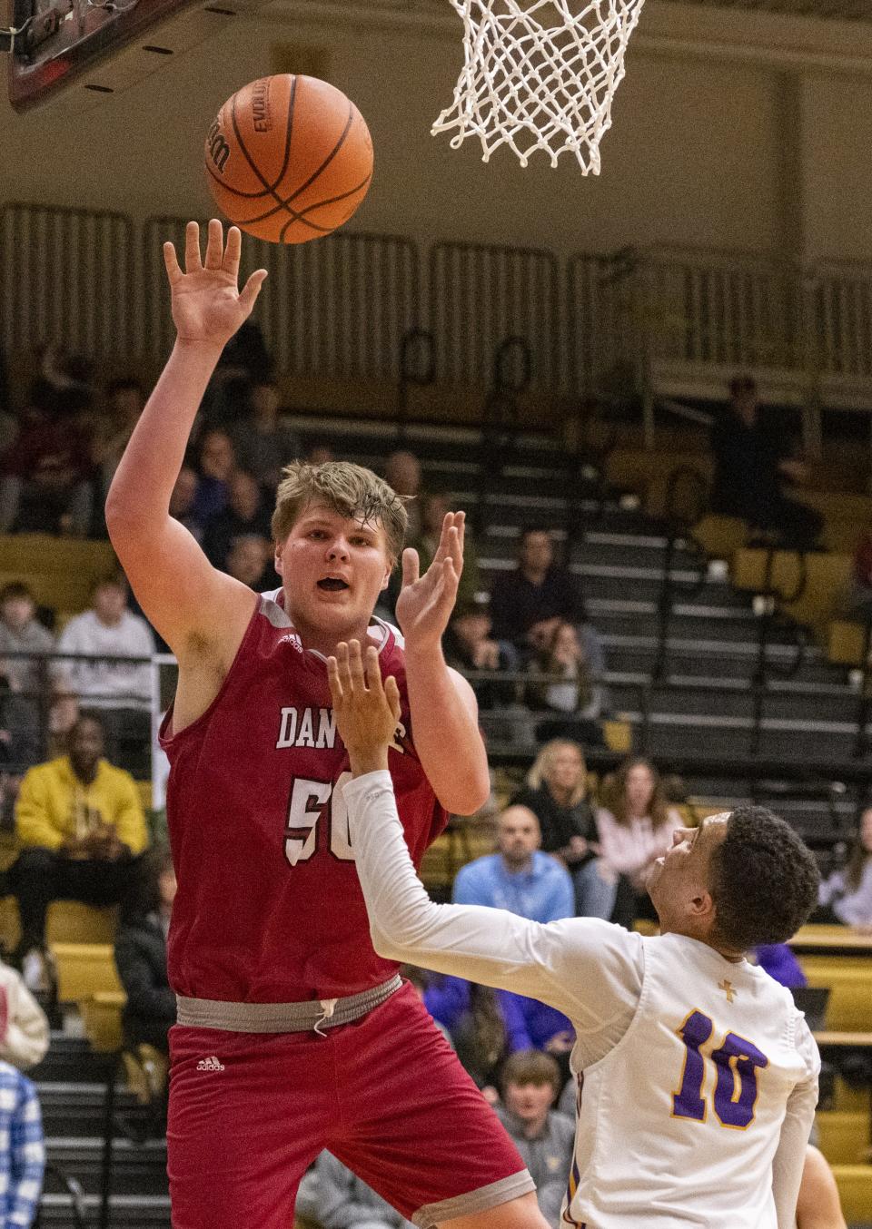 Danville High School junior Evan Lawrence (50) looses control of his shot during the first half of an IHSAA Class 3A Regional championship game against Guerin Catholic High School, Saturday, March 11, 2023, at Lebanon High School.