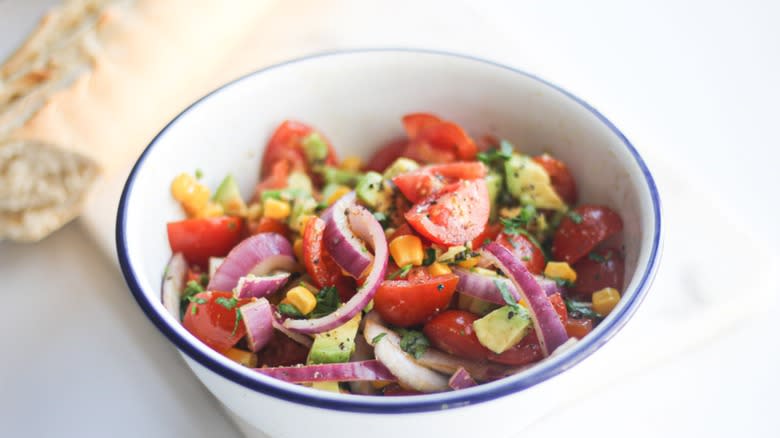 Bowl of avocado tomato salad