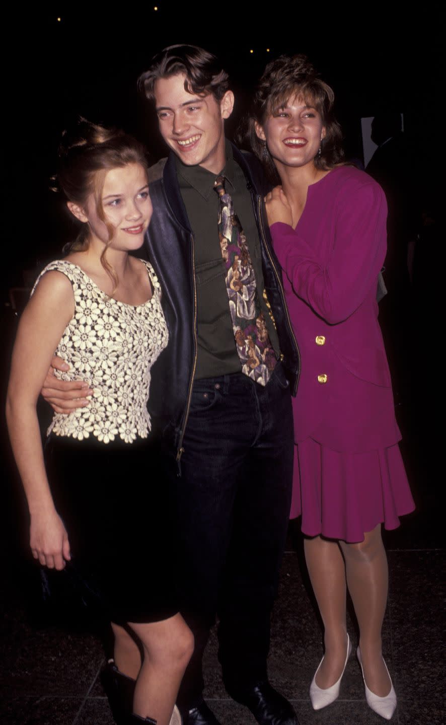 <p>The actress opted for a daisy tank top, black cowboy boots, and a *very* '90s updo for her first movie premiere. Here, she poses with her costars, Jason London and Emily Warfield. </p>