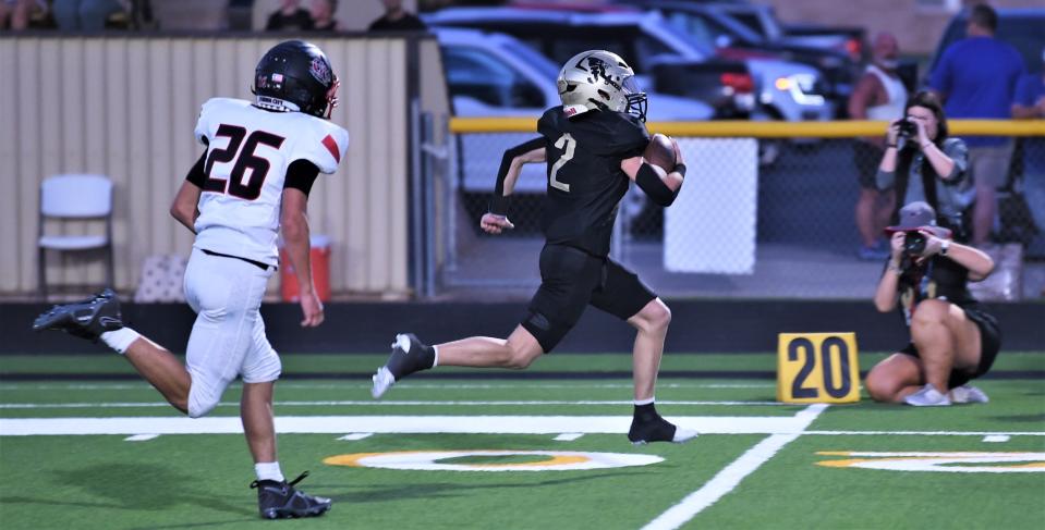 Jayton's Bode Ham (2) runs for a touchdown as Garden City's Blain Walts gives chase. Jayton beat the Bearkats 68-20 at the Jayton Gridiron Classic on Aug. 24 at Jaybird Stadium.