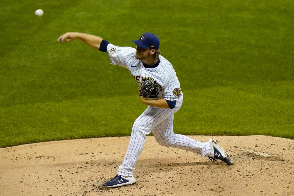 Milwaukee Brewers starting pitcher Corbin Burnes throws during the first inning of a baseball game against the Pittsburgh Pirates Friday, Aug. 28, 2020, in Milwaukee. (AP Photo/Morry Gash)