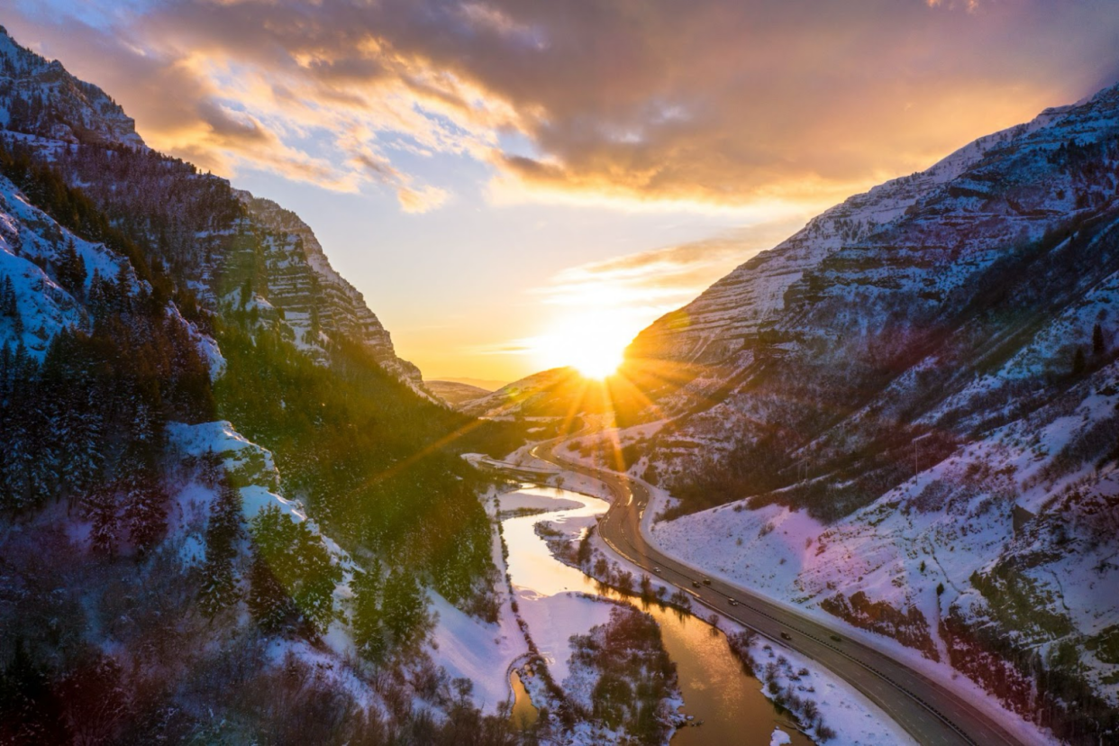 The movie “Falling for Christmas” is a recent Netflix movie with many film locations. Check out where the snowy mountain rom com was filmed. Pictured: the Utah sunset surrounded by snowy mountains