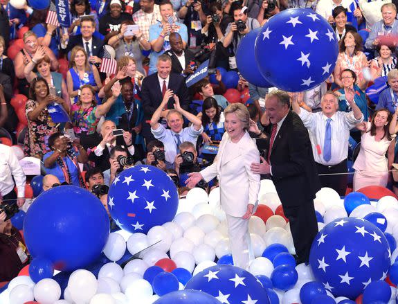 Presidential nominee Hillary Clinton (L) walks with Vice Presidential candidate Tim Kaine through ballons after the fourth and final day of the Democratic National Convention on July 28, 2016 in Philadelphia, Pennsylvania.   / AFP / Brendan Smialowski        (Photo credit should read BRENDAN SMIALOWSKI/AFP/Getty Images)