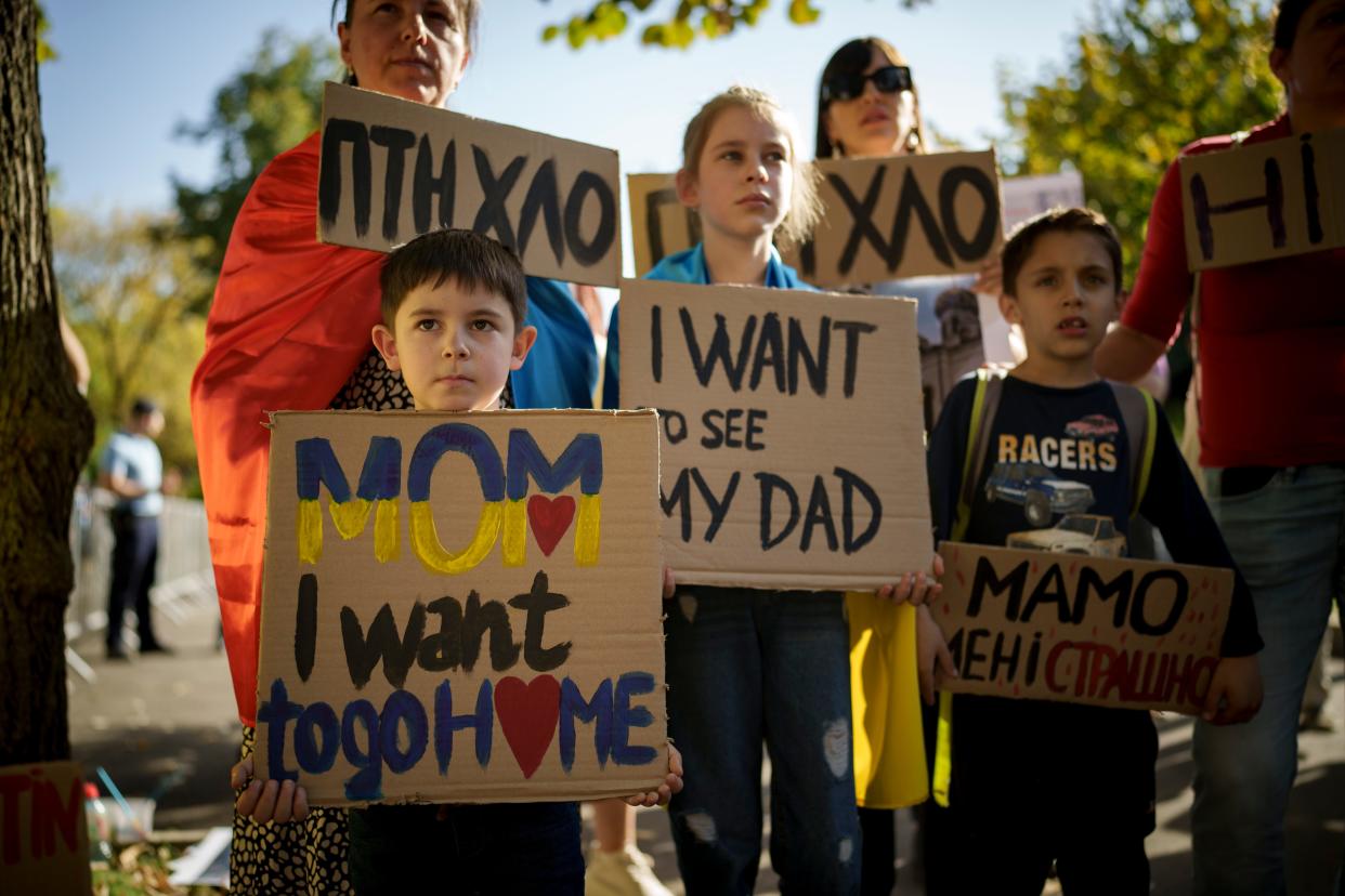 Ukrainian children protest outside the Russian Embassy in Bucharest, Romania, on Oct. 14. Russia invaded neighboring Ukraine in February 2022 and the war has been raging for 18 months. Congress has been battling the Biden administration over whether the U.S. should continue sending aid to Ukraine.