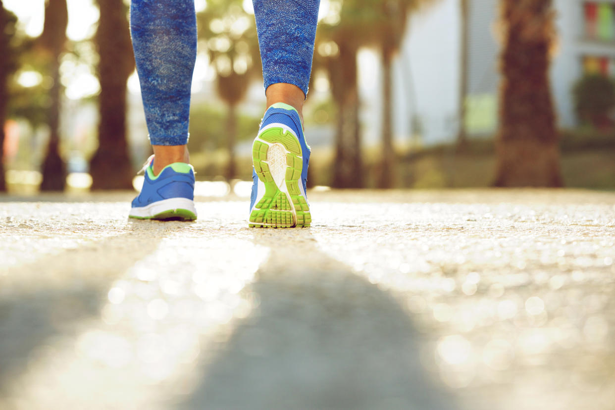 Close up low angle female running shoes from behind