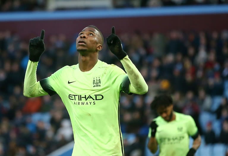 Manchester City striker Kelechi Iheanacho (L) celebrates after scoring his team's third goal during the FA Cup fourth round match against Aston Villa at Villa Park on January 30, 2016