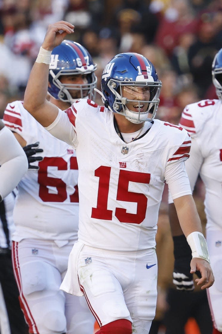 Nov 19, 2023; Landover, Maryland, USA; New York Giants quarterback Tommy DeVito (15) celebrates after throwing a touchdown pass against the Washington Commanders during the second quarter at FedExField. Mandatory Credit: Geoff Burke-USA TODAY Sports