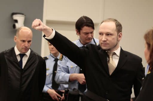 Rightwing extremist Anders Behring Breivik, who killed 77 people in twin attacks in Norway last year, makes a farright salute as he enters court in Oslo