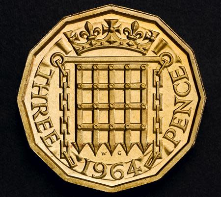 The 12-sided “Threepenny bit” that was in circulation from 1937 until decimalisation in 1971 is shown in this undated handout photo from HM Treasury. Britain's new 1-pound coin, to be introduced in 2017, has the same shape as the "Threepenny bit". REUTERS/HM Treasury/Handout
