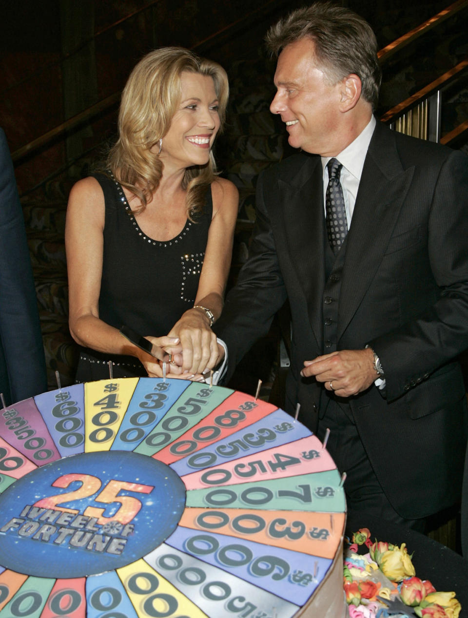 <p>White and <em>Wheel of Fortune </em>host <a href="https://people.com/tv/wheel-of-fortune-host-pat-sajak-says-the-end-is-near-after-40-years/" rel="nofollow noopener" target="_blank" data-ylk="slk:Pat Sajak;elm:context_link;itc:0;sec:content-canvas" class="link ">Pat Sajak</a> celebrate the show's 25th anniversary with quite the cake in 2007. </p> <p>"I think when [series creator] <a href="https://people.com/tag/merv-griffin/" rel="nofollow noopener" target="_blank" data-ylk="slk:Merv Griffin;elm:context_link;itc:0;sec:content-canvas" class="link ">Merv Griffin</a> chose both of us ... years ago, he saw something between us — a brother/sister-type relationship," <a href="https://people.com/tv/vanna-white-opens-up-about-brother-sister-bond-with-pat-sajak/" rel="nofollow noopener" target="_blank" data-ylk="slk:White recently told PEOPLE;elm:context_link;itc:0;sec:content-canvas" class="link ">White recently told PEOPLE</a>. "He saw that we would be able to get along, I think. And we do. We are like a brother and sister team."</p>