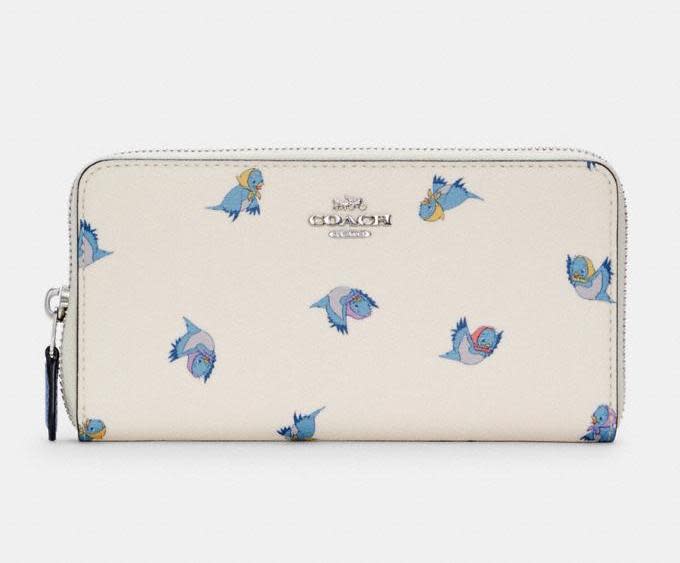 Disney X Coach Accordion Zip Wallet With Cinderella Flying Birds Print. Image via Coach Outlet.