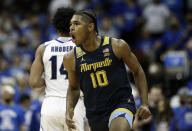 Marquette forward Justin Lewis (10) reacts after making a three point shot against Seton Hall during the second half of an NCAA college basketball game in Newark, N.J. Marquette won 73-63. Wednesday, Jan. 26, 2022. (AP Photo/Noah K. Murray)