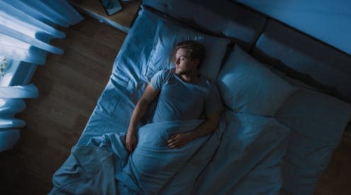 <span class="caption">Change can be tiring and readjusting after such upheaval takes time.</span> <span class="attribution"><a class="link " href="https://www.shutterstock.com/image-photo/top-view-handsome-young-man-sleeping-1427499953" rel="nofollow noopener" target="_blank" data-ylk="slk:Gorodenkoff/Shutterstock;elm:context_link;itc:0;sec:content-canvas">Gorodenkoff/Shutterstock</a></span>