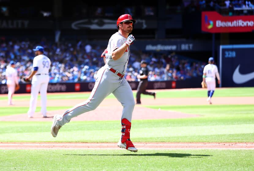 TORONTO, ON - JULY 30: Hunter Renfroe #12 of the Los Angeles Angels celebrates after hitting a two-run home run in the tenth inning against the Toronto Blue Jays at Rogers Centre on July 30, 2023 in Toronto, Ontario, Canada. (Photo by Vaughn Ridley/Getty Images)