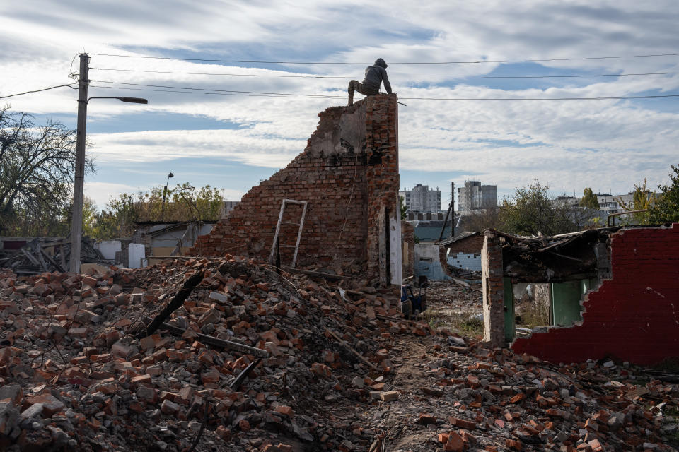 KHARKIV, UKRAINE - OCTOBER 19: Builders work to demolish the remains of a house destroyed by a Russian missile, on October 19, 2022 in Kharkiv, Ukraine. Russia's president Vladimir Putin today imposed martial law on the four Ukrainian regions occupied by Russian forces as large numbers of civilians were being moved out of the Kherson area ahead of a Ukrainian offensive. (Photo by Carl Court/Getty Images)