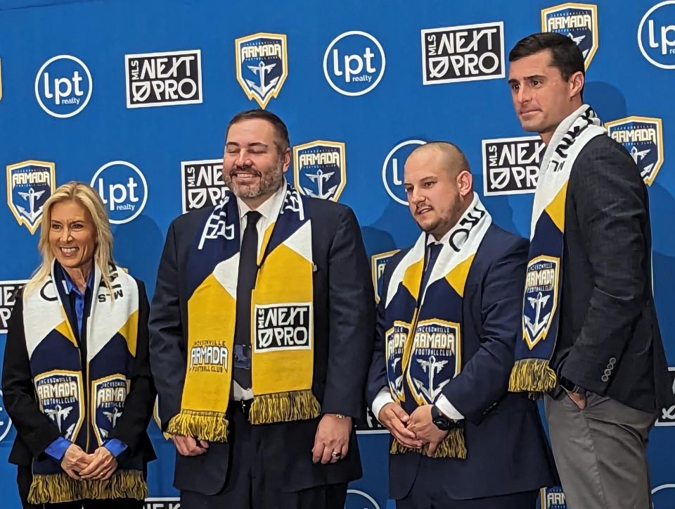 Mayor Donna Deegan, Jacksonville Armada FC owner Robert Palmer, Armada president Nathan Walter & MLS NEXT Pro president Charles Altchek stand on stage at the press conference for Armada league and stadium plans on Thursday.