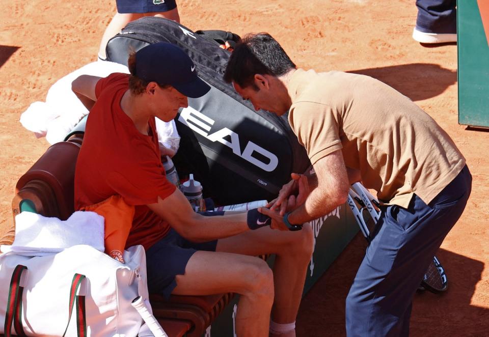 Sinner receives treatment during the third set (Reuters)