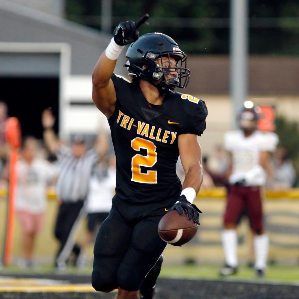 Jayden Wallace celebrates after running for a 5-yard touchdown in the first quarter of a 42-7 win against Pataskala Licking Heights on Aug. 25, 2023, at Jack Anderson Stadium. Wallace led the Muskingum Valley League in rushing.