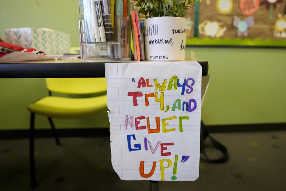 A sign hangs in a classroom during a Lean In session at Girls Inc., Wednesday, July 26, 2023, in Sioux City, Iowa. A new girls leadership program from Lean In, the organization launched after Sheryl Sandberg published her book “Lean In: Women, Work and the Will to Lead,” will help girls response to what Sandberg calls stubborn gender inequities. (AP Photo/Charlie Neibergall)