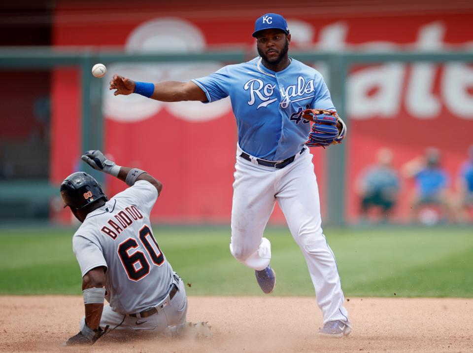 Detroit Tigers' Akil Baddoo (60) is out at second base as Kansas City Royals shortstop Hanser Alberto (49) throws to first for a double play during the sixth inning of a baseball game at Kauffman Stadium in Kansas City, Mo., Sunday, July 25, 2021.