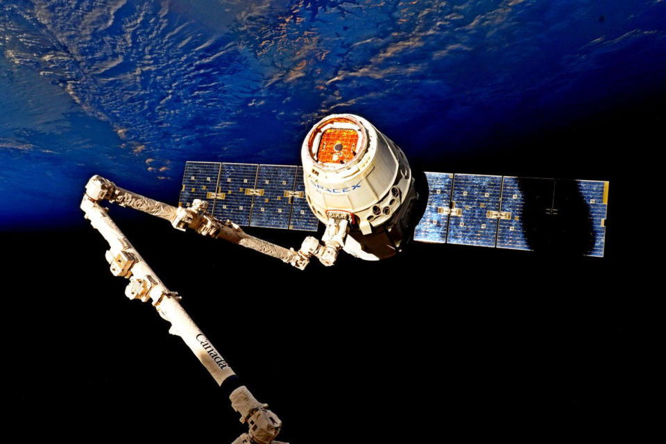 A Dragon cargo vehicle was separated from the space station on July 3 with help from two NASA astronauts and the orbiting outpost's robotic arm. <cite>Jack Fischer/NASA</cite>