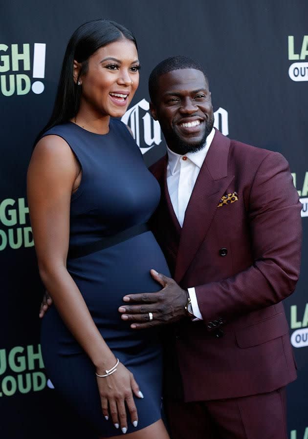 Kevin poses with his pregnant partner Eniko Parrish. Source: Getty