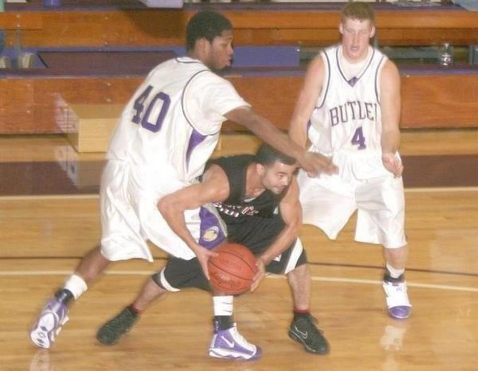 During the 2009-2010 season, Labette Community College guard Shavis Tindall fights off a couple Butler Community College defenders.