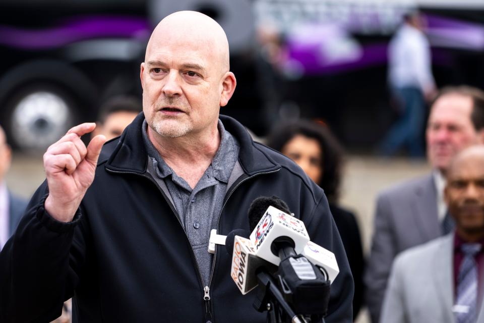 Jesse Case, secretary-treasurer of Teamsters Local 238, speaks on the Iowa Capitol steps during a a demonstration Wednesday.