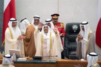 FILE PHOTO: Kuwait's Emir Sheikh Sabah al Ahmad al Sabah waves as he leaves parliament session in Kuwait City