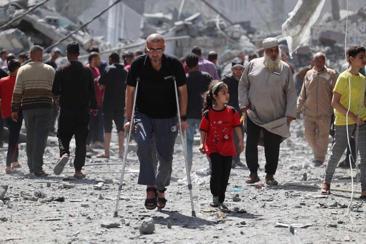 Palestinians inspect the debris after Israeli bombardment at Al-Daraj neighbourhood in Gaza City (AFP via Getty Images)