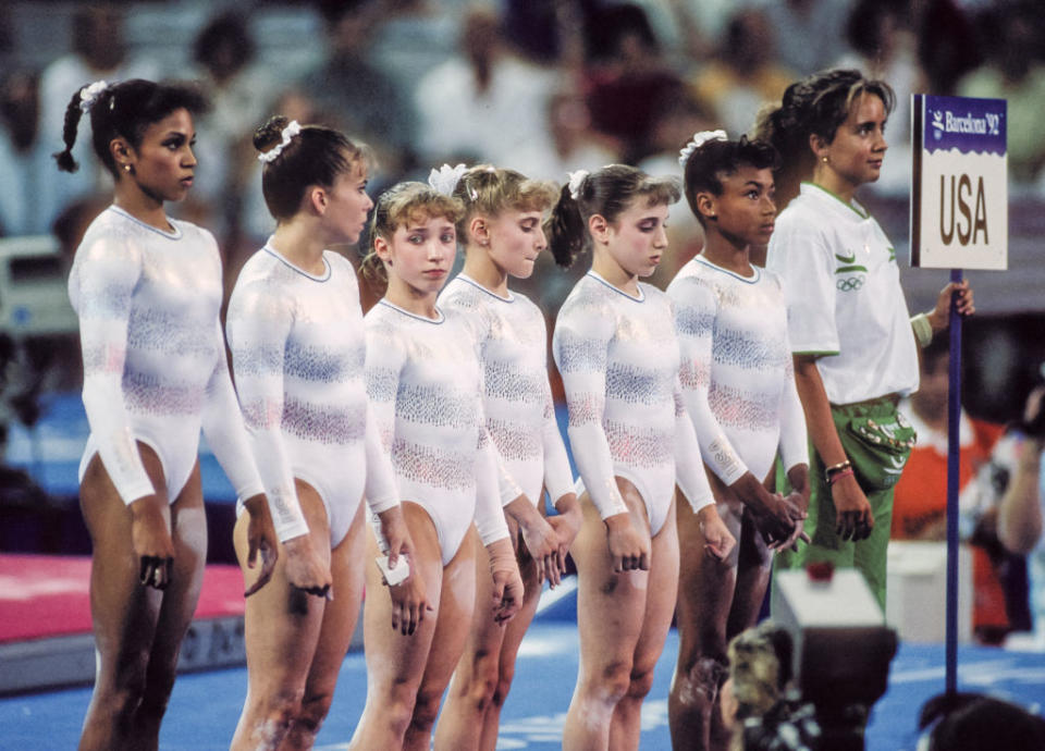 L to R: Betty Okino, Wendy Bruce, Kim Zmeskal, Shannon Miller, Kerri Strug and Dominque Dawes of Team USA during the 1992 Barcelona Olympics, gymnastics, athletes, sports, uniforms, leotards