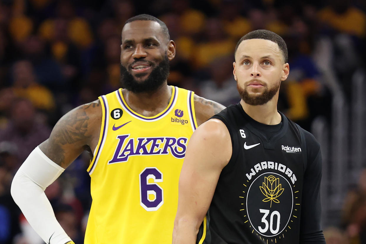 SAN FRANCISCO, CALIFORNIA - MAY 02: LeBron James #6 of the Los Angeles Lakers stands next to Stephen Curry #30 of the Golden State Warriors during the second quarter in game one of the Western Conference Semifinal Playoffs at Chase Center on May 02, 2023 in San Francisco, California. NOTE TO USER: User expressly acknowledges and agrees that, by downloading and or using this photograph, User is consenting to the terms and conditions of the Getty Images License Agreement. (Photo by Ezra Shaw/Getty Images)