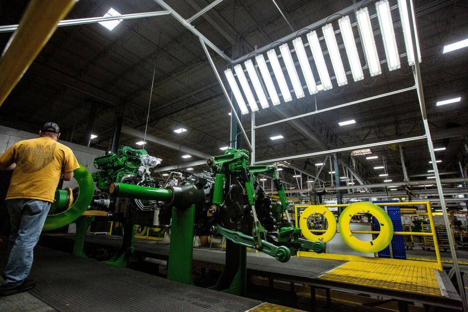 A tractor chassis is prepped for paint at John Deere's Waterloo assembly plant.