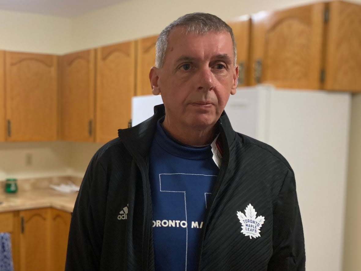 Brian (Smokey) Osmond is the proud recipient of some Toronto Maple Leafs gear, straight from the president of the team himself.  (Malone Mullin/CBC - image credit)