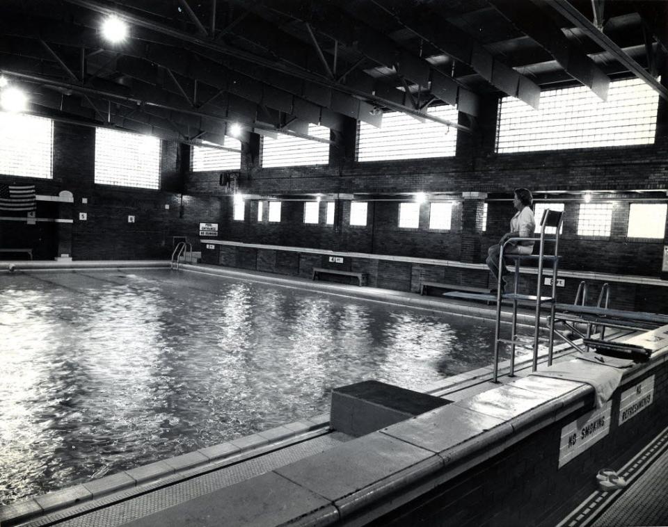 In September 1968, Nettie Reiss, manager of the South Bend city natatorium, sits in the lifeguard chair near the swimming pool.