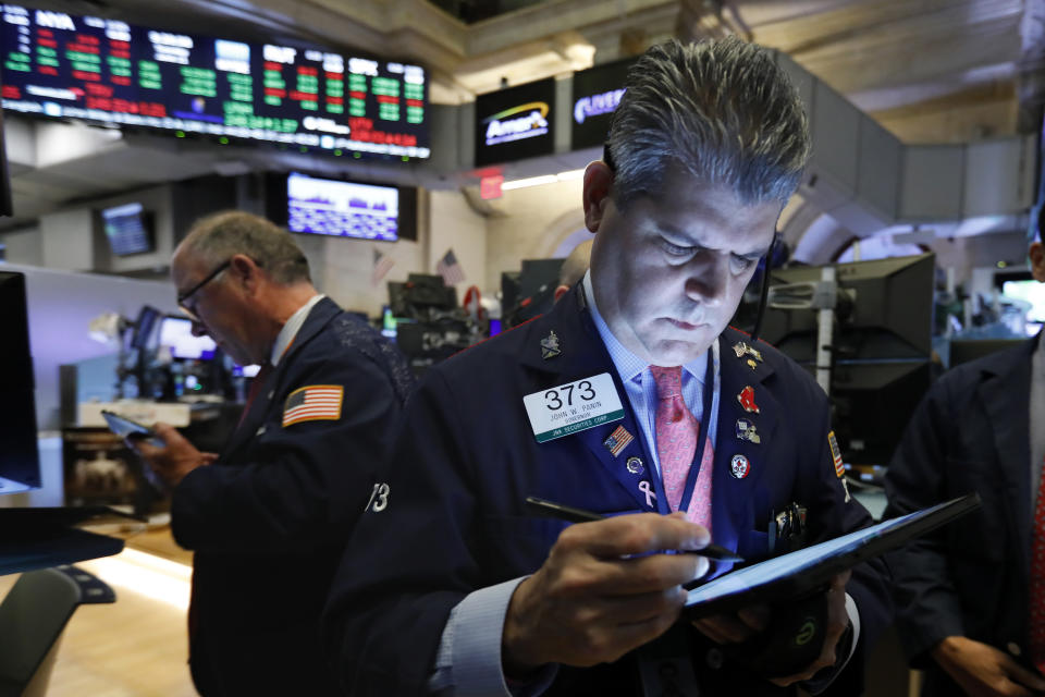 Trader John Panin, right, works on the floor of the New York Stock Exchange, Tuesday, June 11, 2019. Stocks are rising early Tuesday as Wall Street continues to thrive in June. (AP Photo/Richard Drew)