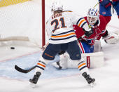 Edmonton Oilers' Dominik Kahun (21) scores the third goal against Montreal Canadiens goaltender Jake Allen (34) during second-period NHL hockey game action in Montreal, Monday, May 10, 2021. (Ryan Remiorz/The Canadian Press via AP)