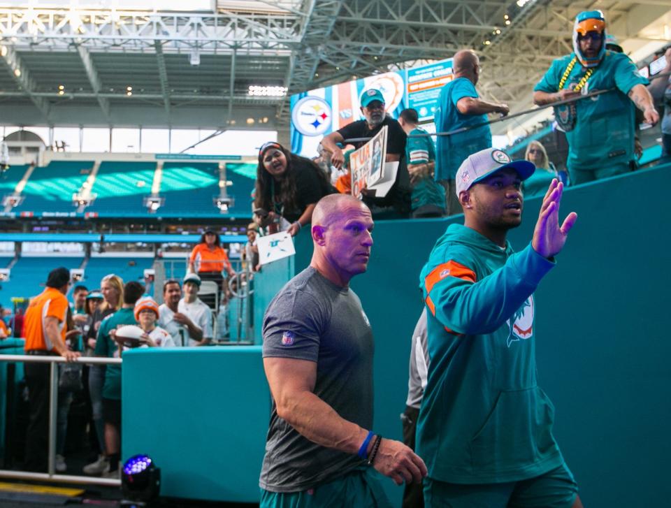 Dolphins quarterback Tua Tagovailoa waves to the fans at Hard Rock Stadium after walking around the field before Sunday night's game against the Steelers. Tua is expected to start his first game in three weeks.