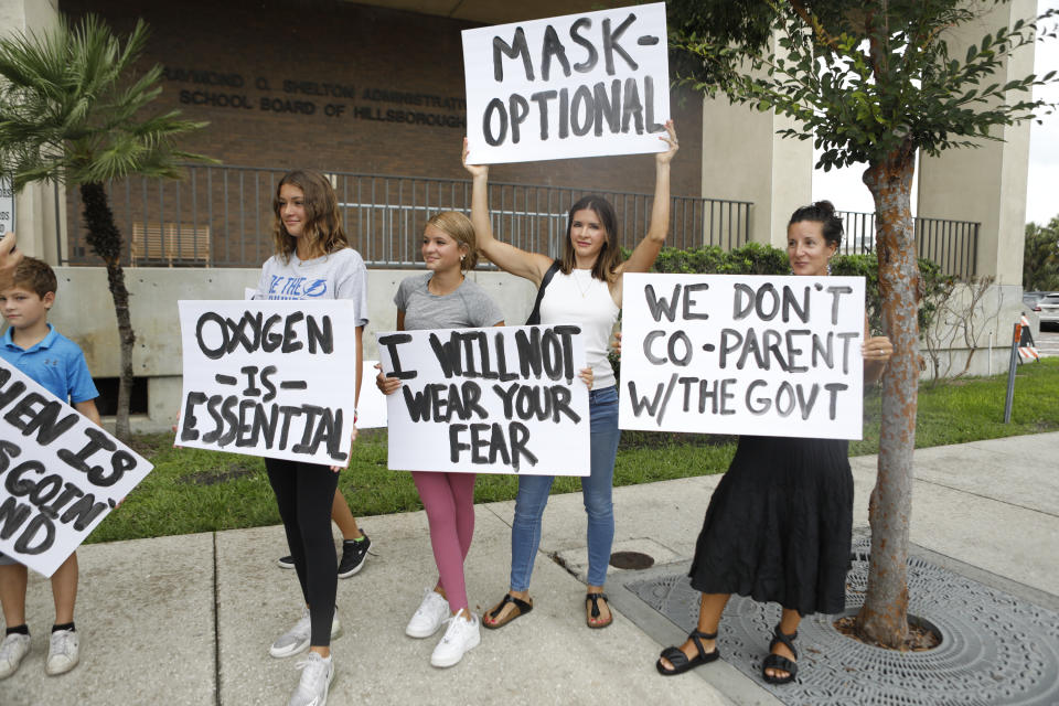 Families protest any potential mask mandates before the Hillsborough County Schools Board meeting held at the district office on July 27, 2021 in Tampa, Florida. (Photo by Octavio Jones/Getty Images)