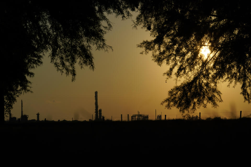 FILE - The Denka Performance Elastomer Plant sits at sunset in Reserve, La., on Sept. 23, 2022. Federal officials are suing Louisiana chemical maker Denka Tuesday, Feb. 28, 2023, alleging that it presented an unacceptable cancer risk to the nearby majority-Black community and demanding cuts in toxic emissions. (AP Photo/Gerald Herbert, File)