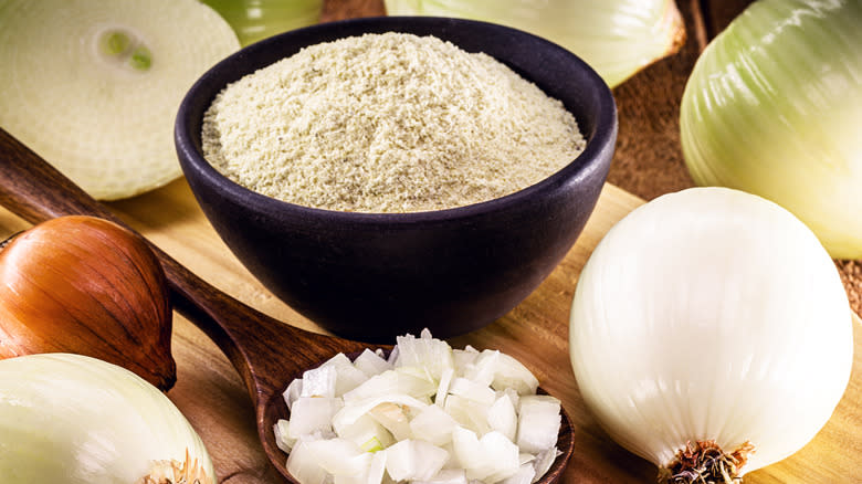 bowl of onion powder with fresh onions