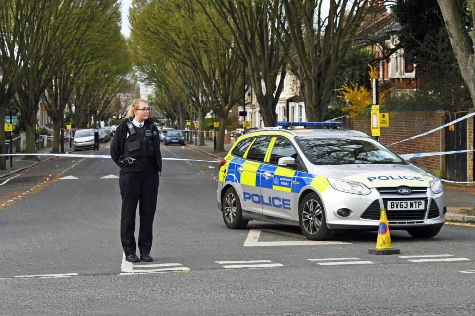 A police officer stands at a cordon in Chestnut Avenue in Forest Gate (PA)