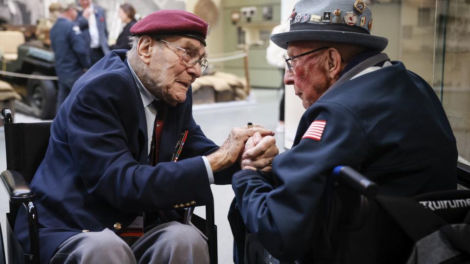 World War II veteran Britain's Bill Gladden, left, speaks with U.S WWII veteran Jack M. Larson in the Pegasus Bridge memorial in Benouville, Normandy, Monday June 5, 2023. (Thomas Padilla/AP)