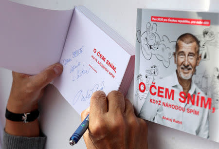 The leader of ANO party Andrej Babis signs his books during an election campaign rally in Prague, Czech Republic September 28, 2017. REUTERS/David W Cerny