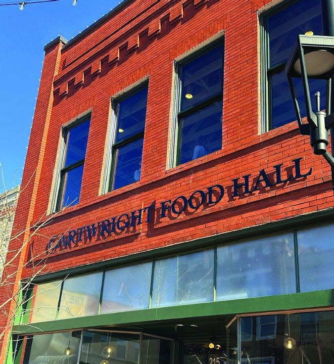 The Cartwright Food Hall building was constructed in 1865 as a showroom for horse carriages. Today, it is home to Flying Fox Coffee, Mi Irie On Trade, Mo Mo’s Sushi and More, (soon-to-open) Anonymous Burgers, Whistle Pig Art, Trade Street Taproom, and White Wine & Butter.