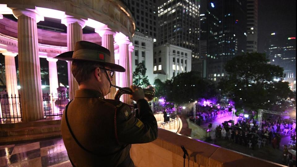 Thousands gathered in the rain for the dawn service at Brisbane’s Anzac Square. Source: AAP