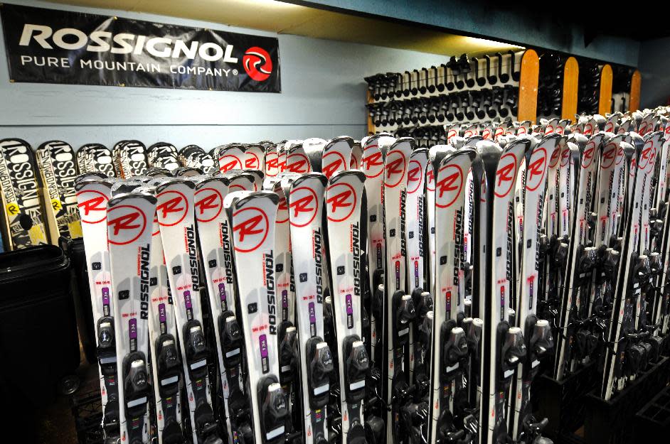 This January 2013 photo shows a display of skis for rent at the Ski & Ride Center at Schweitzer Mountain Resort in Sandpoint, Idaho. Some skiers see renting gear as a good alternative to bringing their own skis on a plane, partly because of airline baggage fees and partly because they can get the latest gear and skis for local conditions if they rent. (AP Photo/Schweitzer Mountain Resort)