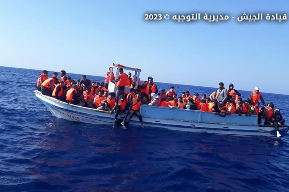 In this photo released by the Lebanese Army official website shows an overcrowded boat with migrants in the Mediterranean Sea, near the shores of Tripoli, north Lebanon, Friday, Oct. 6, 2023. Lebanon's state-run National News Agency says the army has rescued more than 100 migrants after their boat faced technical problems in the Mediterranean Sea. The agency says the boat called for help after it ran into difficulties Friday afternoon in Lebanese territorial waters. (Lebanese Army Website via AP)